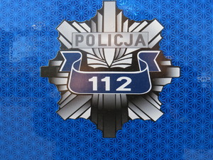 rozeta z napisem policja 112