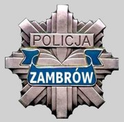 rozeta z napisem policja