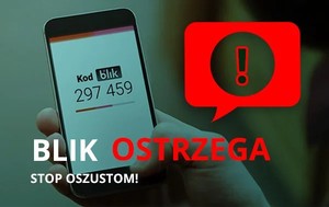 napis blik ostrzega stop oszustom w dłoni telefon komórkowy