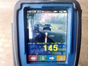 widok z fotoradaru z samochodem osobowym i prędkością która jechał- 145 kilometrów na godzinę